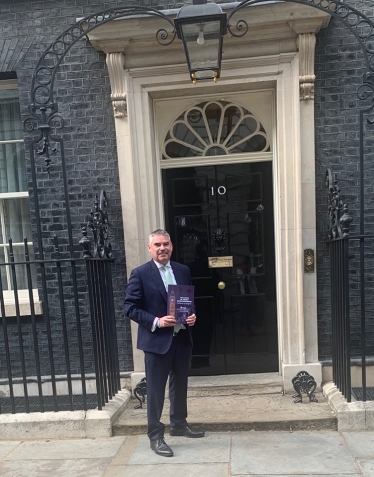 Craig Tracey MP delivering the Report to the Prime Minister